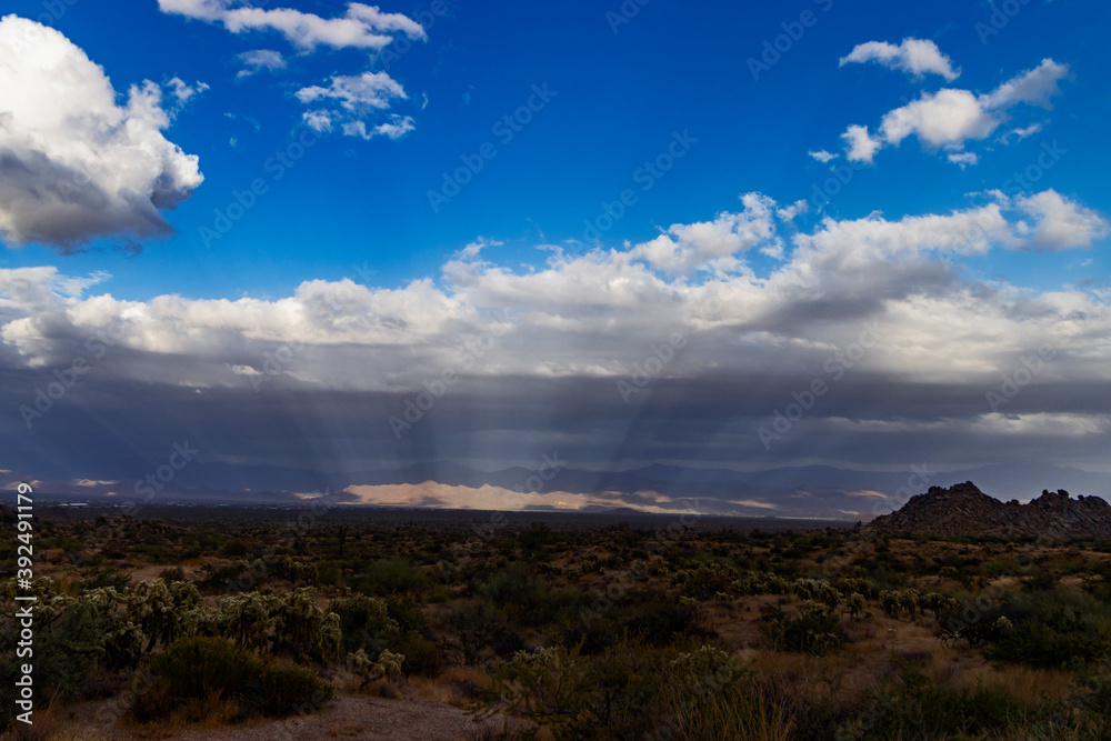 Wide Landscape Image Of Sunbeams Over Arizona Desert