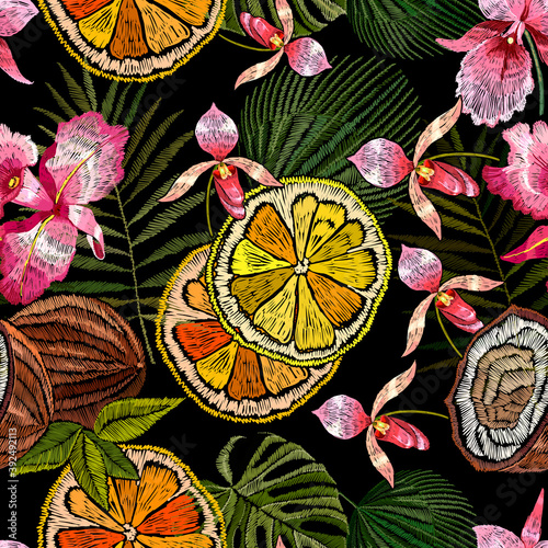 Pink orchid flowers, lemons, coconuts and palm leaves seamless pattern. Embroidery. Jungle paradise art. Fashionable template for design of clothes