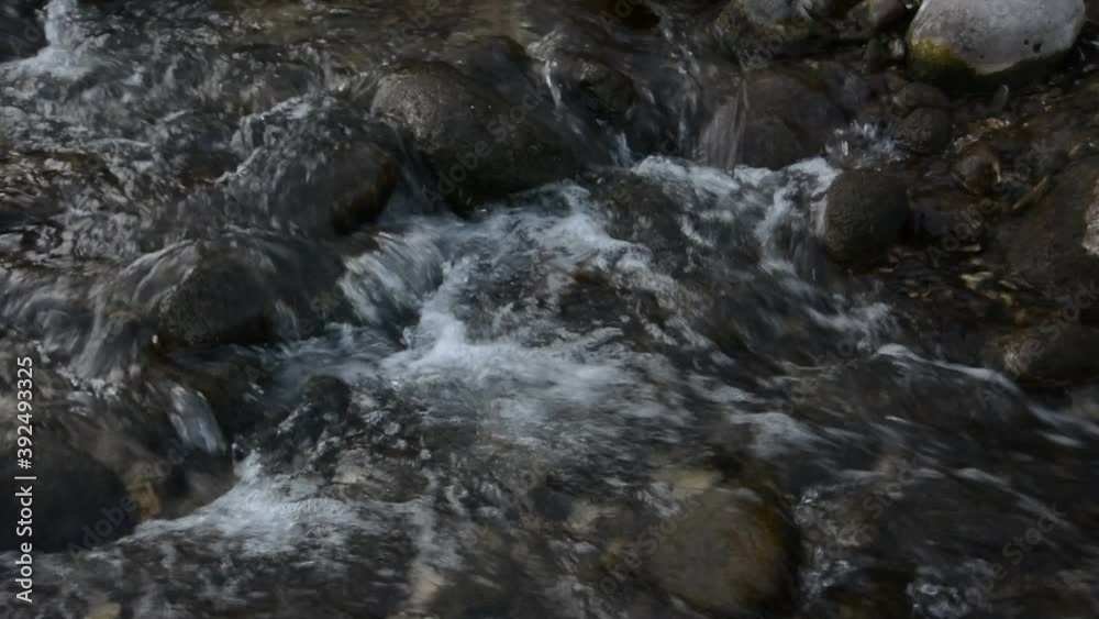 A small waterfall on a mountain river. A small waterfall on a mountain river.
