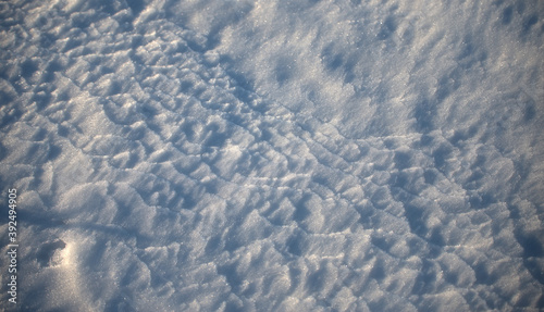 Texture, snow cover, surface, with traces of a blizzard, shallow depth of field