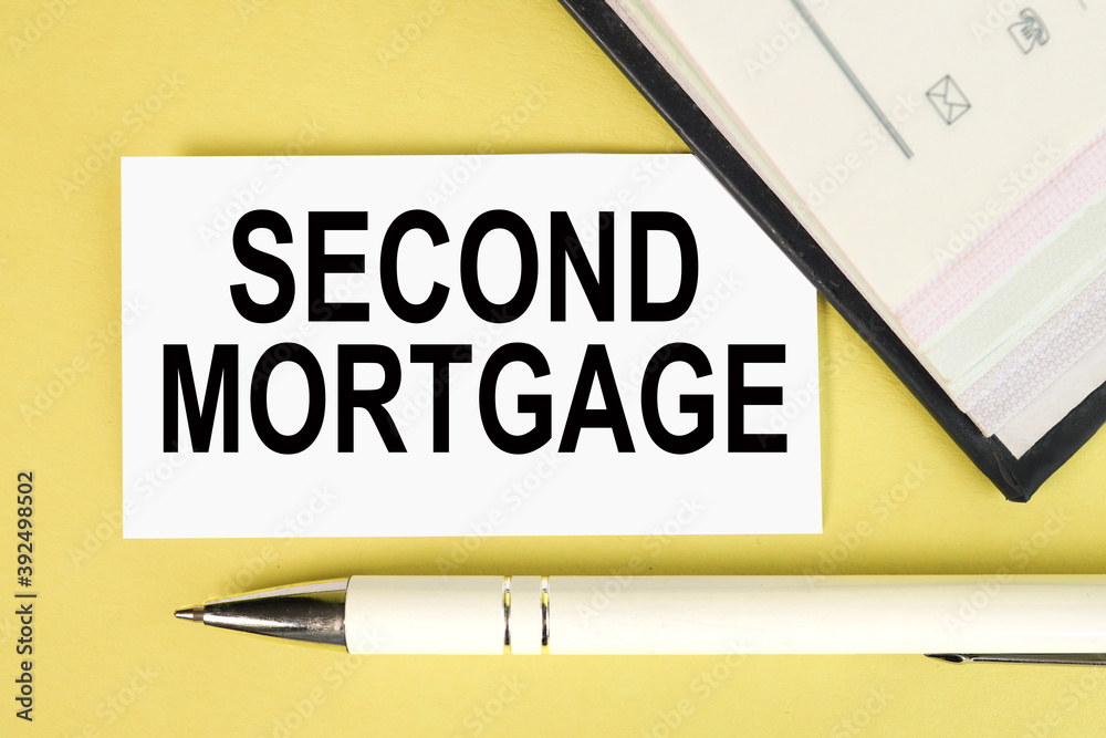 SECOND MORTGAGE, text on white paper on yellow background SECOND MORTGAGE, text on white paper on yellow background
