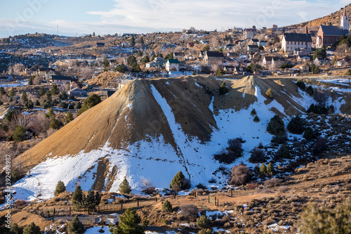 Snow covered tailing pile on the edge of historic Virginia City nevada photo