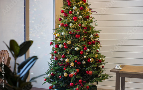 beautiful Christmas tree decorated with gold and red balls