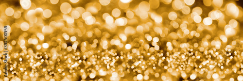 Golden panoramic abstract bokeh background.