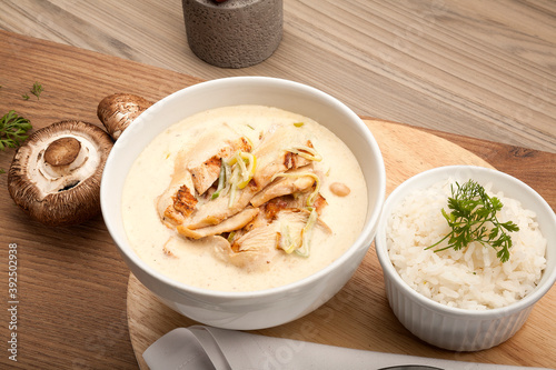 Creamy chicken mushroom soup, easy chicken soup recipe with optional cream of mushroom soup and herbs in a white bowl.