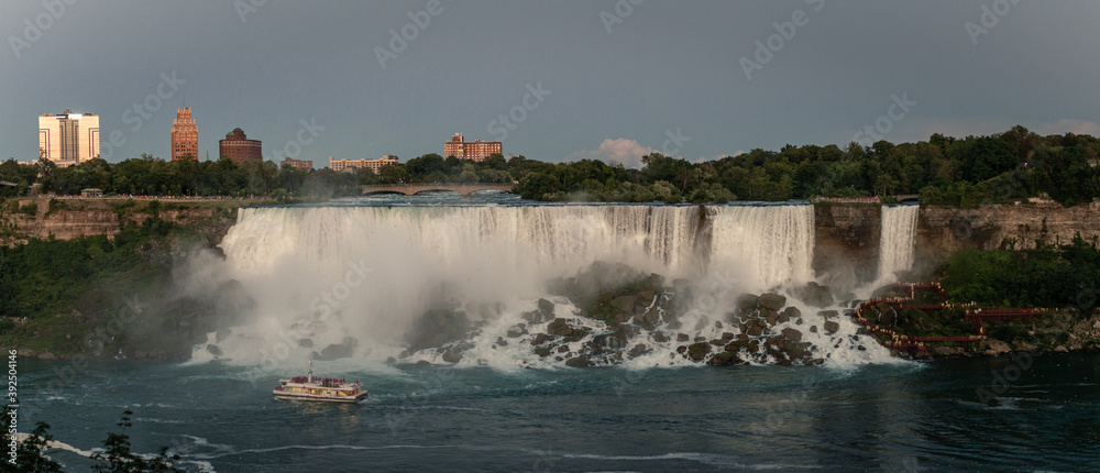 Panorama view of American waterfalls with tourist boat at bottom, shooted from Canada Panorama view of American waterfalls with tourist boat at bottom, shooted from Canada