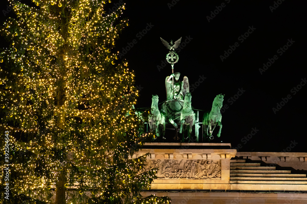 A Christmas tree in front of the Berlin Brandenburg Gate.