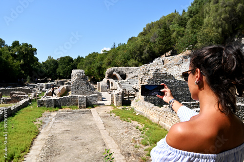 Young girl exploring an ruins of ancient city of Butrint.