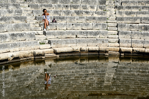 Young girl exploring an ruins of ancient city of Butrint.