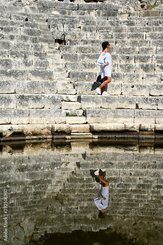 Young girl exploring an ruins of ancient city of Butrint.