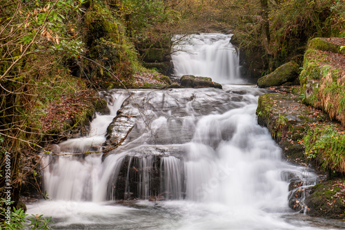 Long exposure of a the big waterfall at Watersmmet in Exmoor National Park in autumn photo