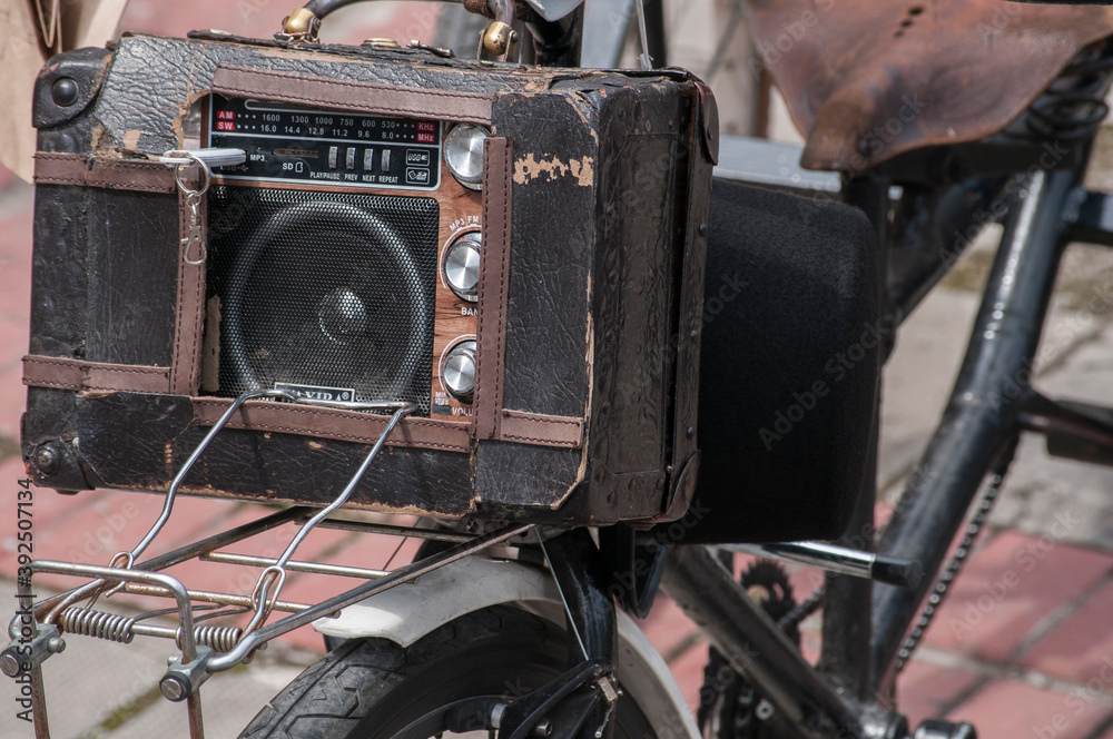 Fototapeta premium Vintage radio mounted on old fashioned three wheel bike