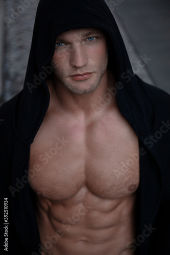 athletic guy in a hoodie