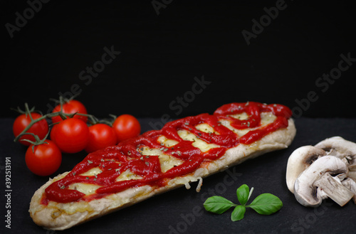 Open-faced toasted cheese sandwich with ketchup