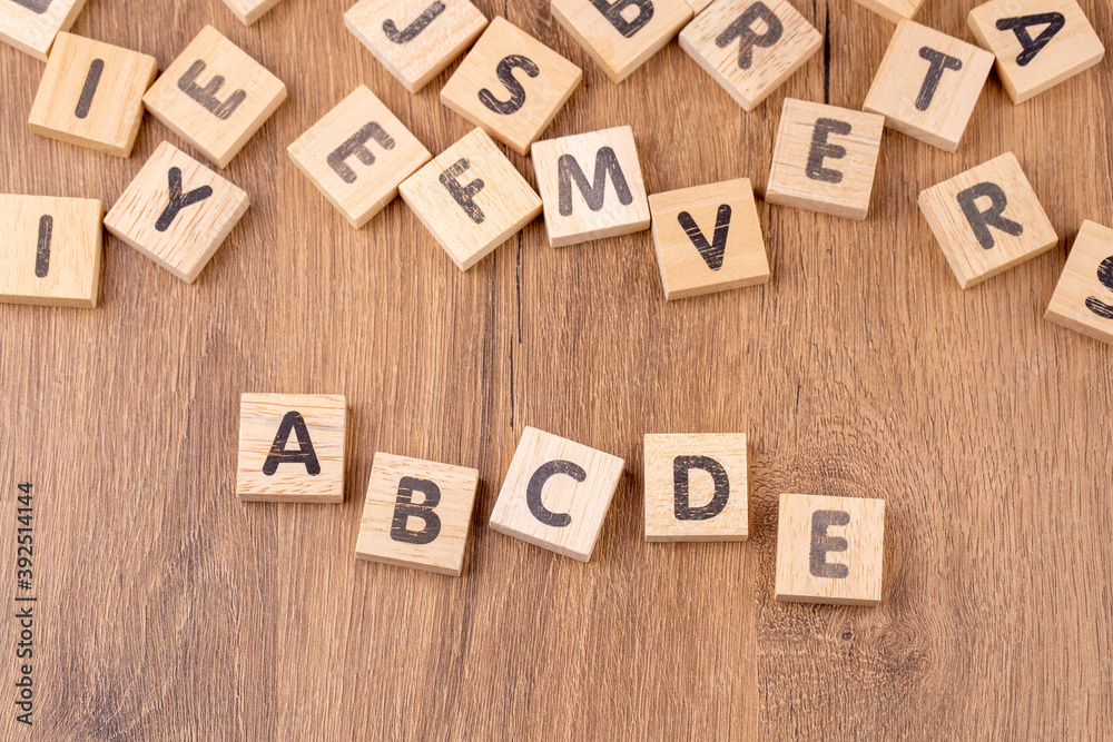 Alphabets on wooden cubes as a background Alphabets on wooden cubes as a background
