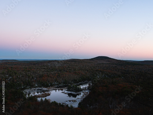 Fototapeta Naklejka Na Ścianę i Meble -  Twilight on Binney Pond as seen from Pratt Mountain on the Wapack Trail in New Ipswich New Hampshire