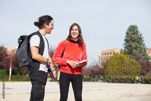 two happy university students at the school campus