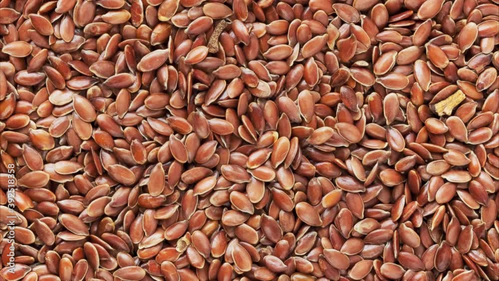 Background and texture of rotating flax seeds. View from above. Background and texture of rotating flax seeds. View from above.