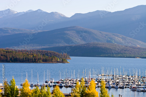 Dillon Marina Autumn - Sail boats docked at Dillon Marina on Dillon Reservoir in Autumn with Arapahoe National Forest in background, Summit County, Colorado
