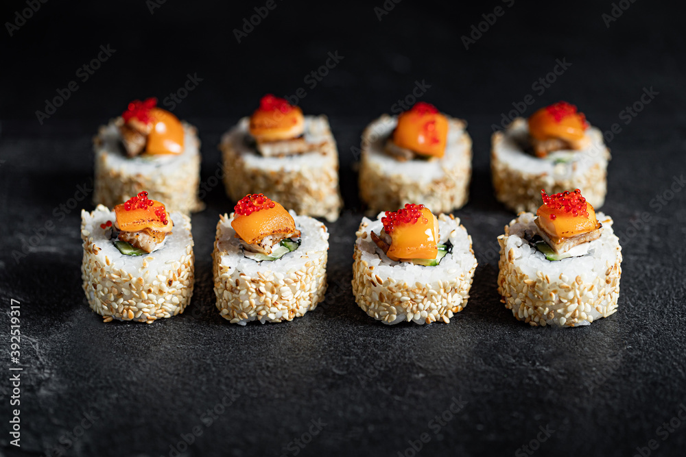 Sushi Rolls Set, maki, philadelphia and california rolls, on a Black background. Sushi Rolls Set, maki, philadelphia and california rolls, on a Black background.