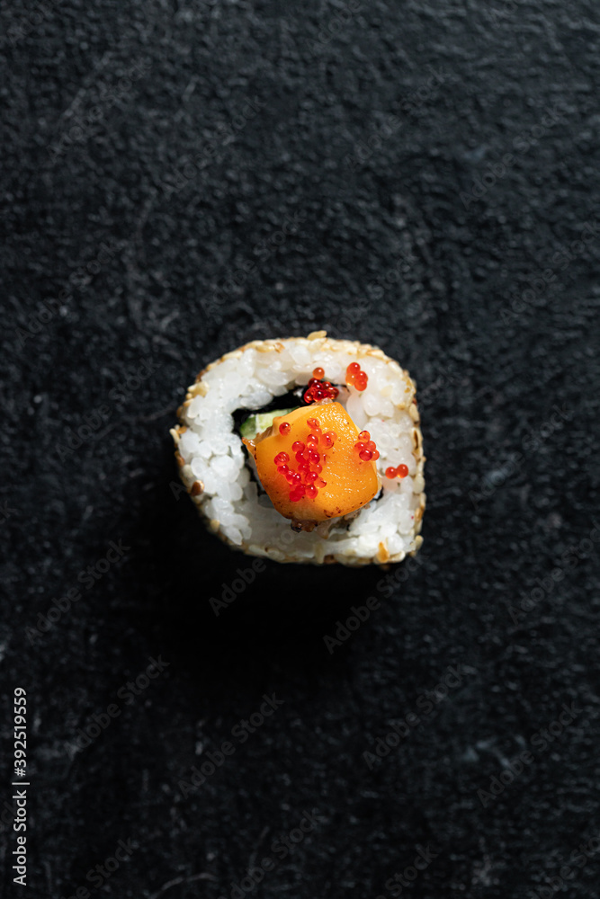 Sushi Rolls Set, maki, philadelphia and california rolls, on a Black background. Sushi Rolls Set, maki, philadelphia and california rolls, on a Black background.