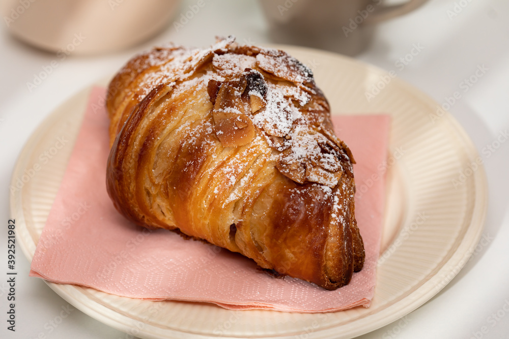 Homemade almond croissant and coffee Homemade almond croissant and coffee