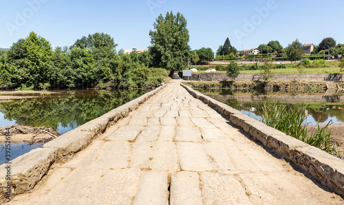 Ponte das Taipas - old pedestrian bridge over Ave river in Caldelas (Caldas das Taipas) town, Guimarães municipality, District of Braga, Portugal © Jorge Anastacio