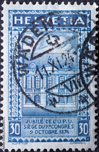 Switzerland - Circa 1924 : a postage stamp printed in the swiss showing a drawing of the old estate in Bern. Occasion: 50 year anniversary of the Universal Postal Union in 1874