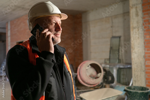 Builder is talking on phone...
