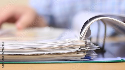 Man flips through documents in files