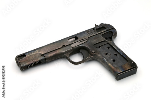 Old pistol on white background