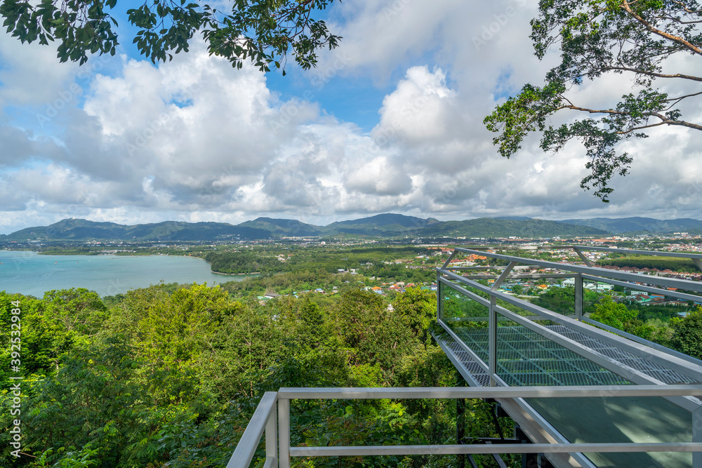Terrace with a beautiful landscape scenery view of Tropical sea and mountain blue sky white clouds in Phuket Thailand.