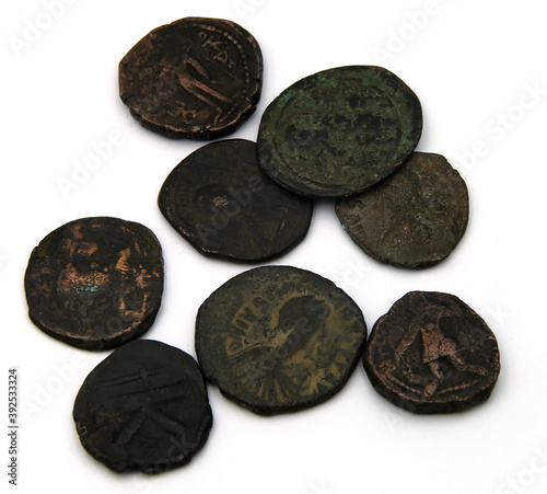 Ancient copper coins on white background photo