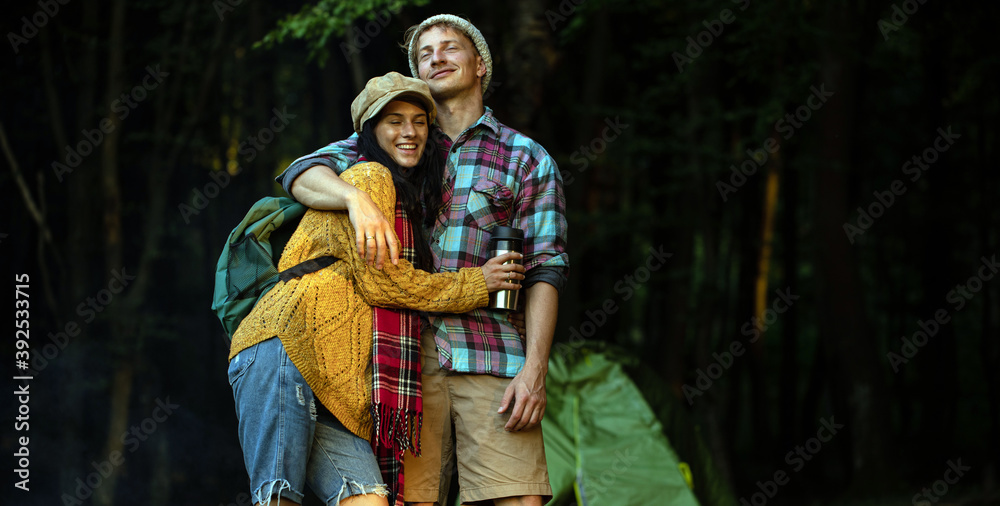Shot of a happy couple camping on the nature Shot of a happy couple camping on the nature