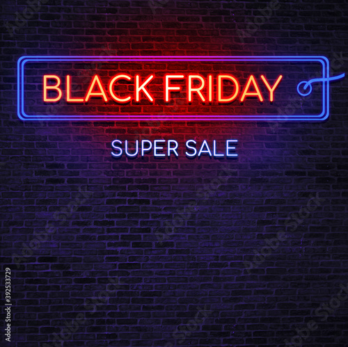 Neon sign Black Friday sale. Brick wall as a background. Seasonal sale, shopping and store concept