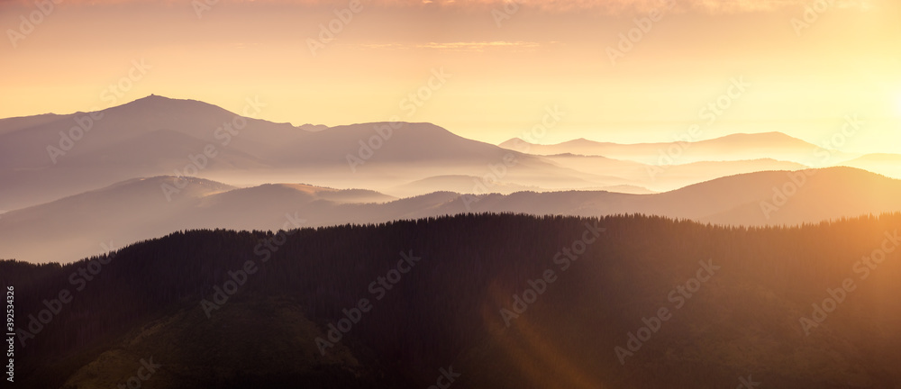 Panoramic evening landscape in the mountains at sunset. Panoramic evening landscape in the mountains at sunset.