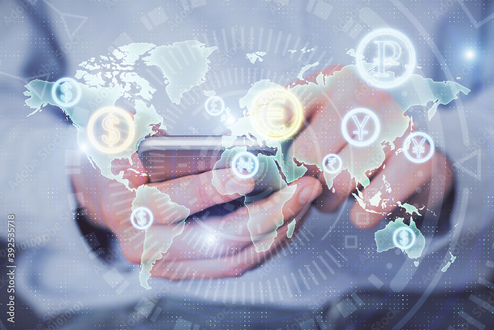 Fototapeta premium Double exposure of man's hands holding and using a digital device and forex graph drawing. Financial market concept.