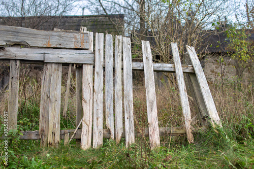 old bright collapsing wooden fence