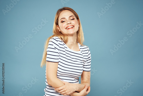 Pretty woman striped t-shirt fun emotions lifestyle blue background