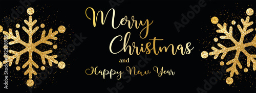card or banner on "Merry Christmas and Happy New Year" in gold with gold colored snowflakes on a black background
