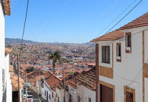 view of classic colonial street with red roofs at sucre white city in bolivia