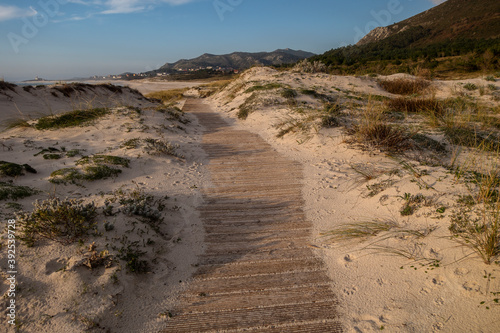 wood path to Lariño wild beach in Carnota, Galicia, Spain photo