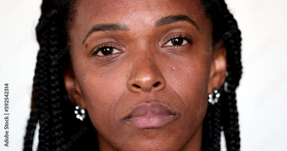 Serious African american black woman portrait staring camera, close-up face portrait Serious African american black woman portrait staring camera, close-up face portrait