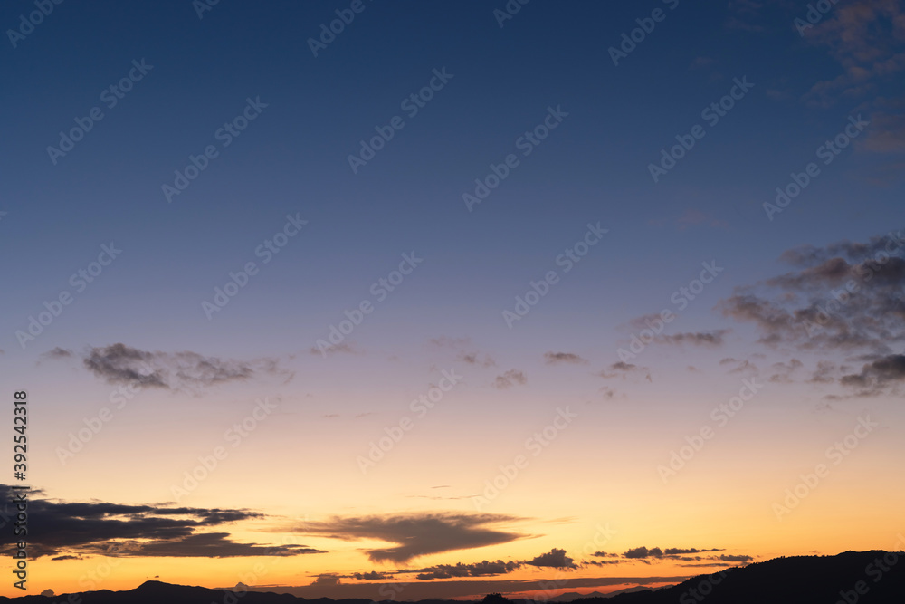 Sunset background with wonderful golden yellow sky,
