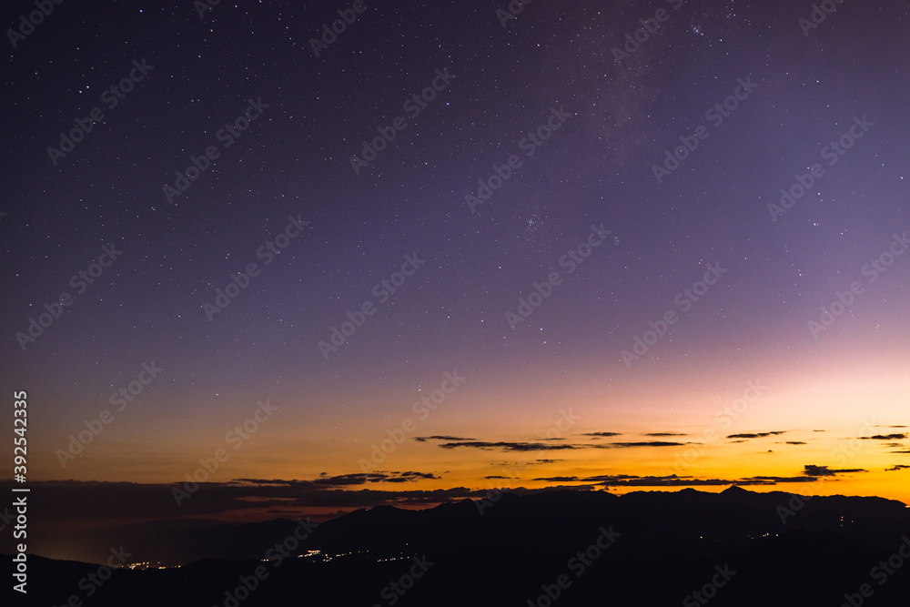 Amazing galaxy with the milky way and golden bright light before sunset,