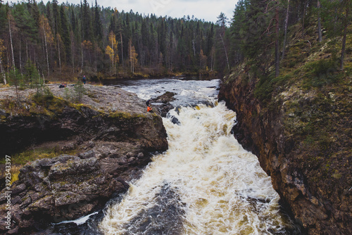 Autumn view of Oulanka National Park, landscape, a finnish national park in the Northern Ostrobothnia and Lapland regions of Finland,  wooden wilderness hut, cabin cottage, bridge, campground place photo