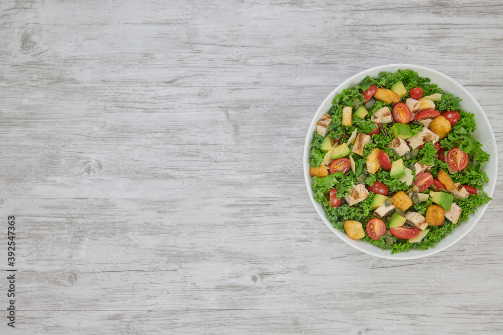 Grilled Chicken Avocado Salad with Kale, Grilled Chicken, Avocado, Grape Tomatoes, Croutons, Pepitas, and Parmesan. Grilled Chicken Avocado Salad with Kale, Grilled Chicken, Avocado, Grape Tomatoes, Croutons, Pepitas, and Parmesan.