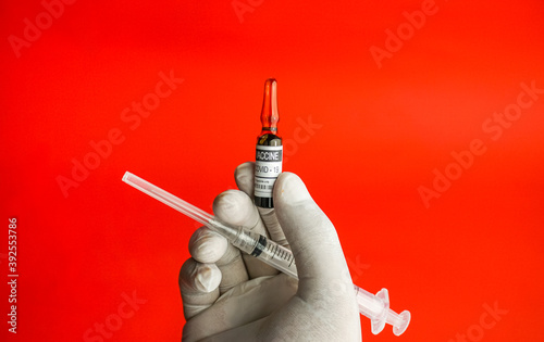 COVID-19 vaccine concept, coronavirus vaccine, immunization and treatment for new corona virus infection, hand with covid vaccine
