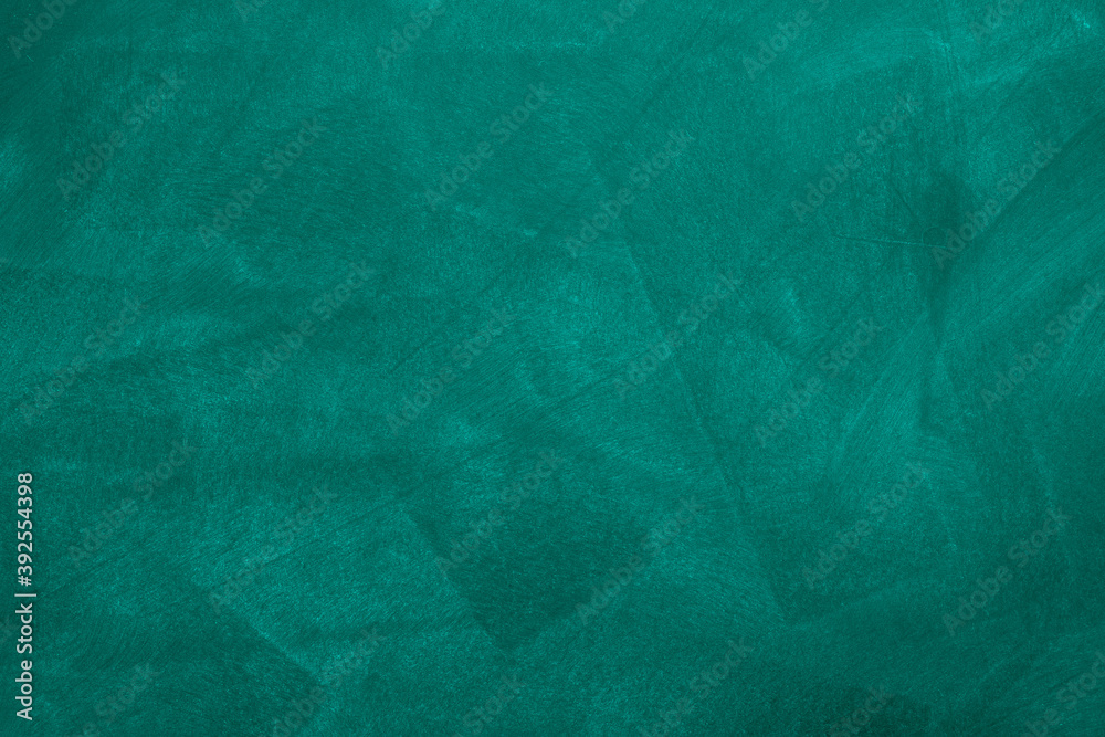 Obraz premium Abstract texture of chalk rubbed out on green blackboard or chalkboard background. School education, dark wall backdrop or learning concept.
