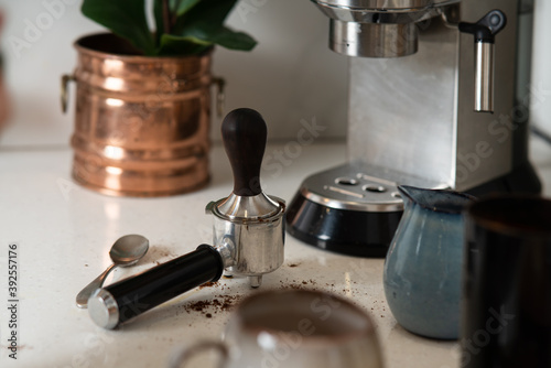Morning ritual. Making espresso coffee in home coffee maker. Having breakfast concept